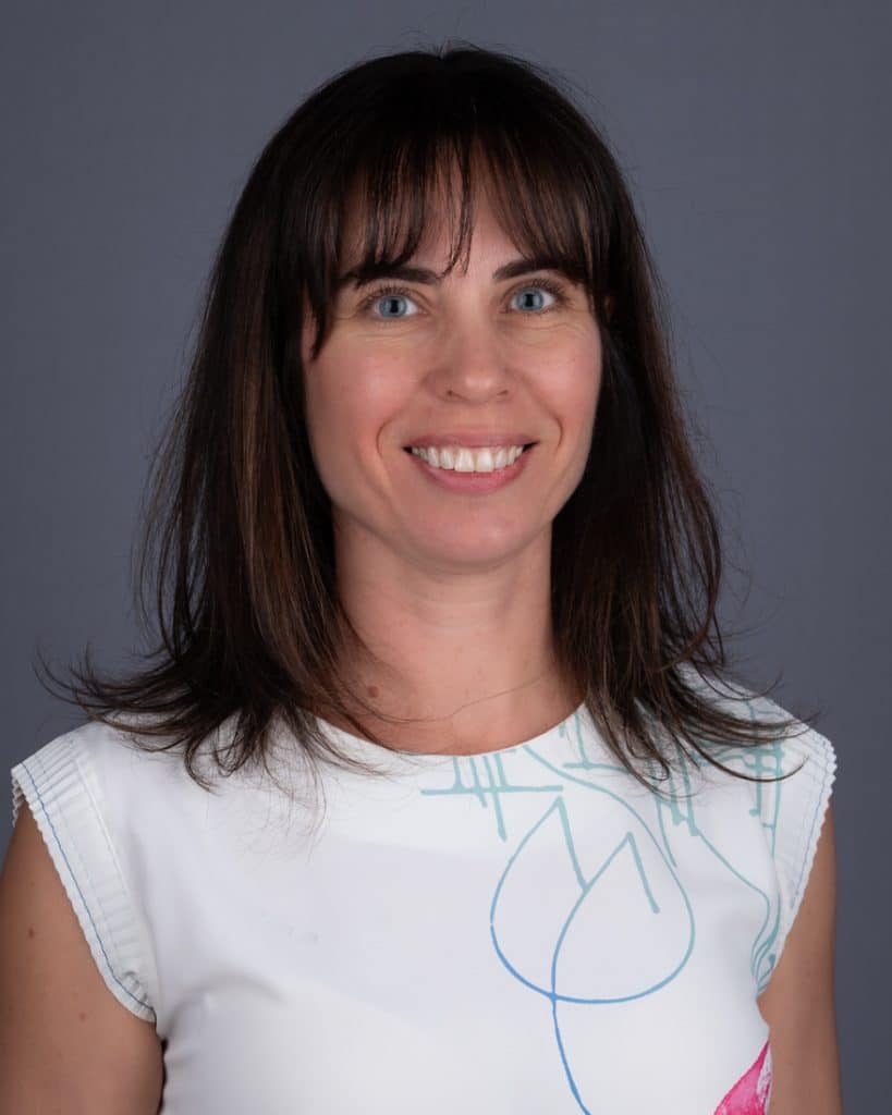 Headshot of Ottawa woman business person white top on grey background