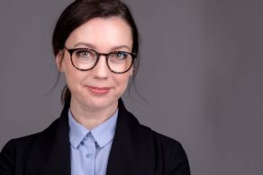 pretty woman headshot on grey wearing brown glasses in ottawa