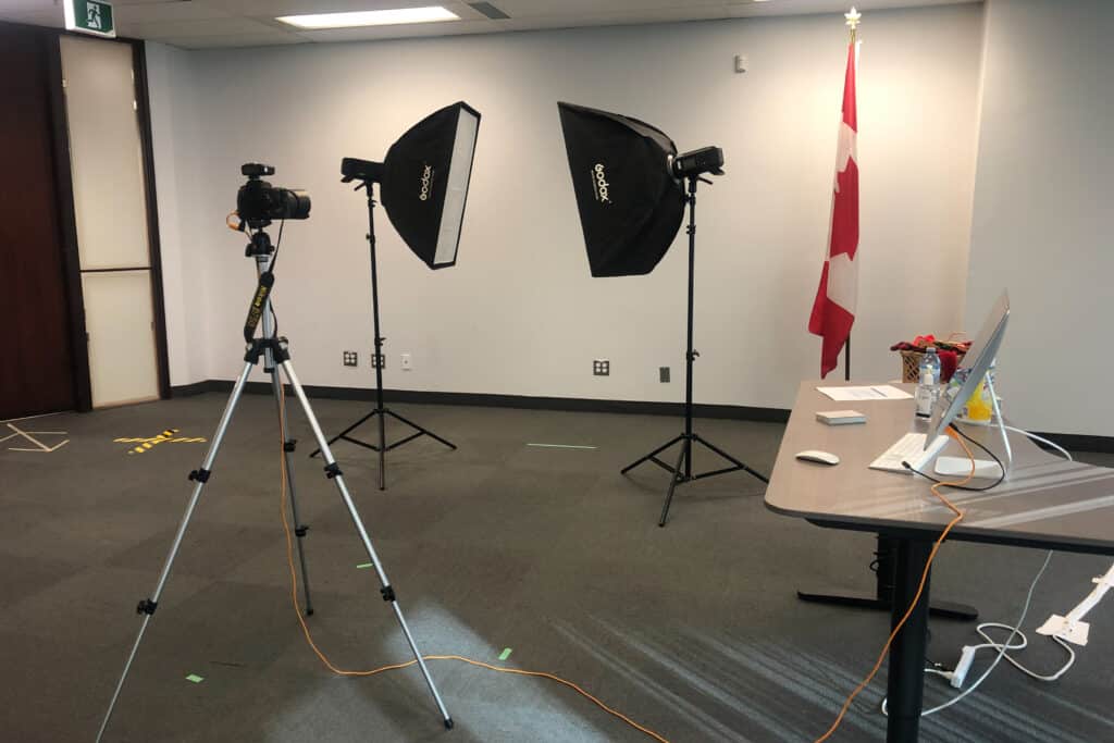 headshot set up in a large office on white wall